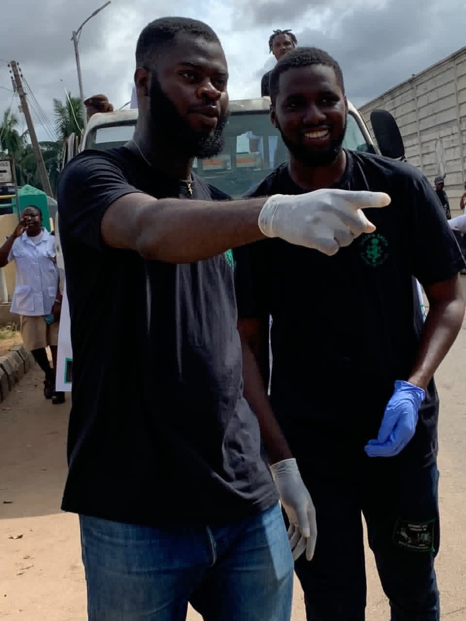 Two people in gloves during a community activity